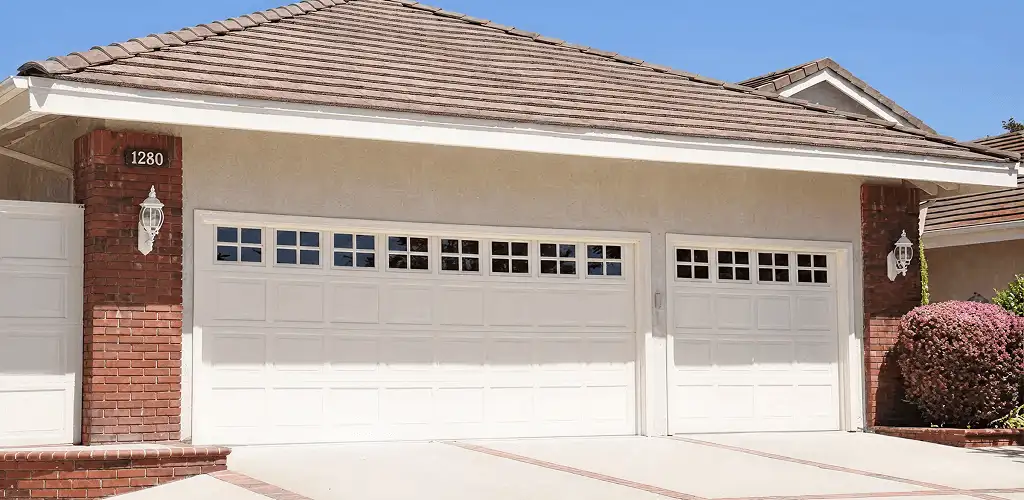 Residential garage door repair service for a double garage door in Lincoln, NE