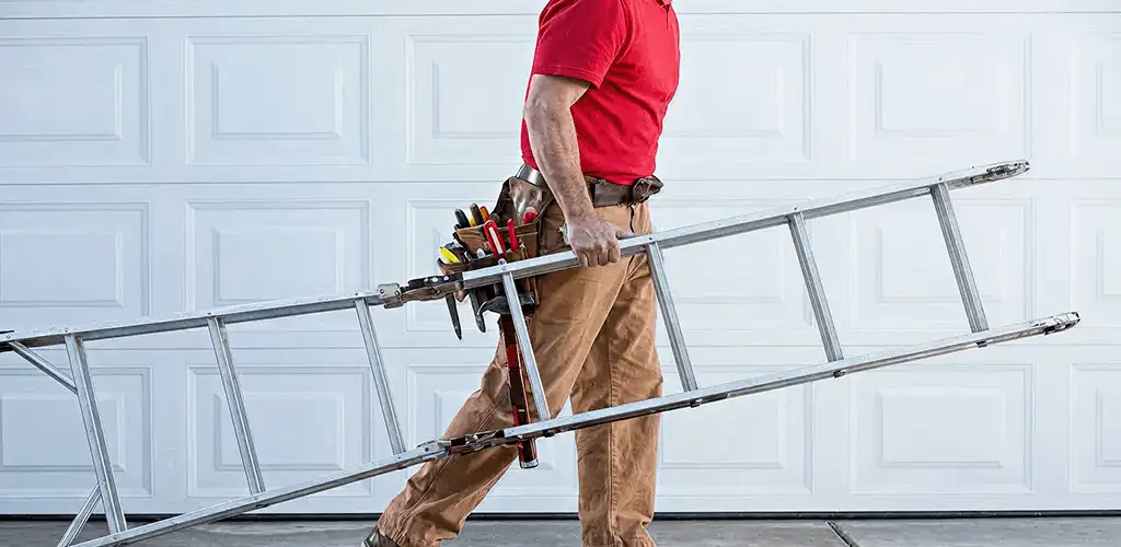 Garage door repair technician arriving with tools and ladder in Lincoln, NE