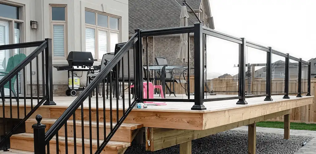 Handrail installation on a deck staircase for safety and code compliance in Lincoln, NE
